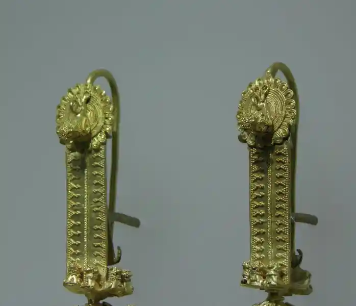 Gold pendant with winged-animal design